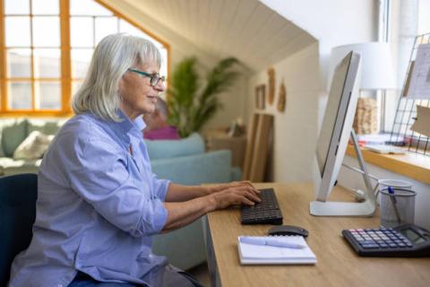 Woman typing on computer 
